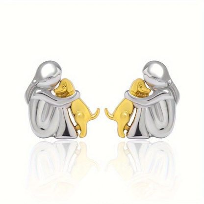 A little girl and a dog embrace earrings